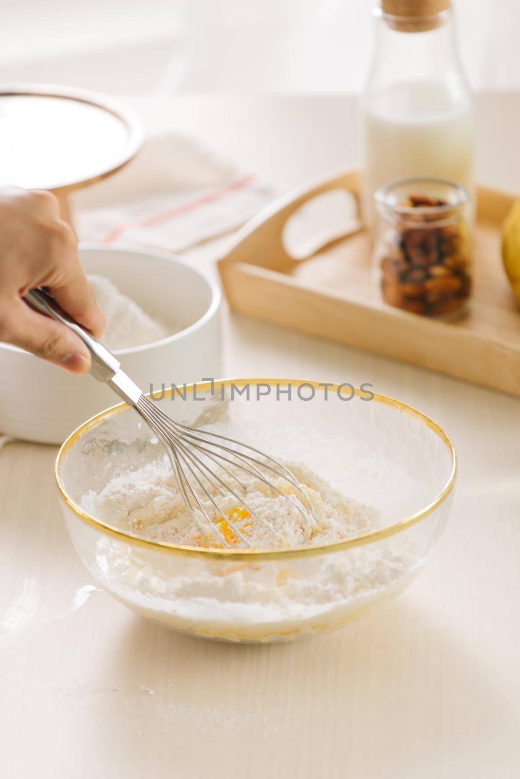 fresh eggs milk and flour on white table