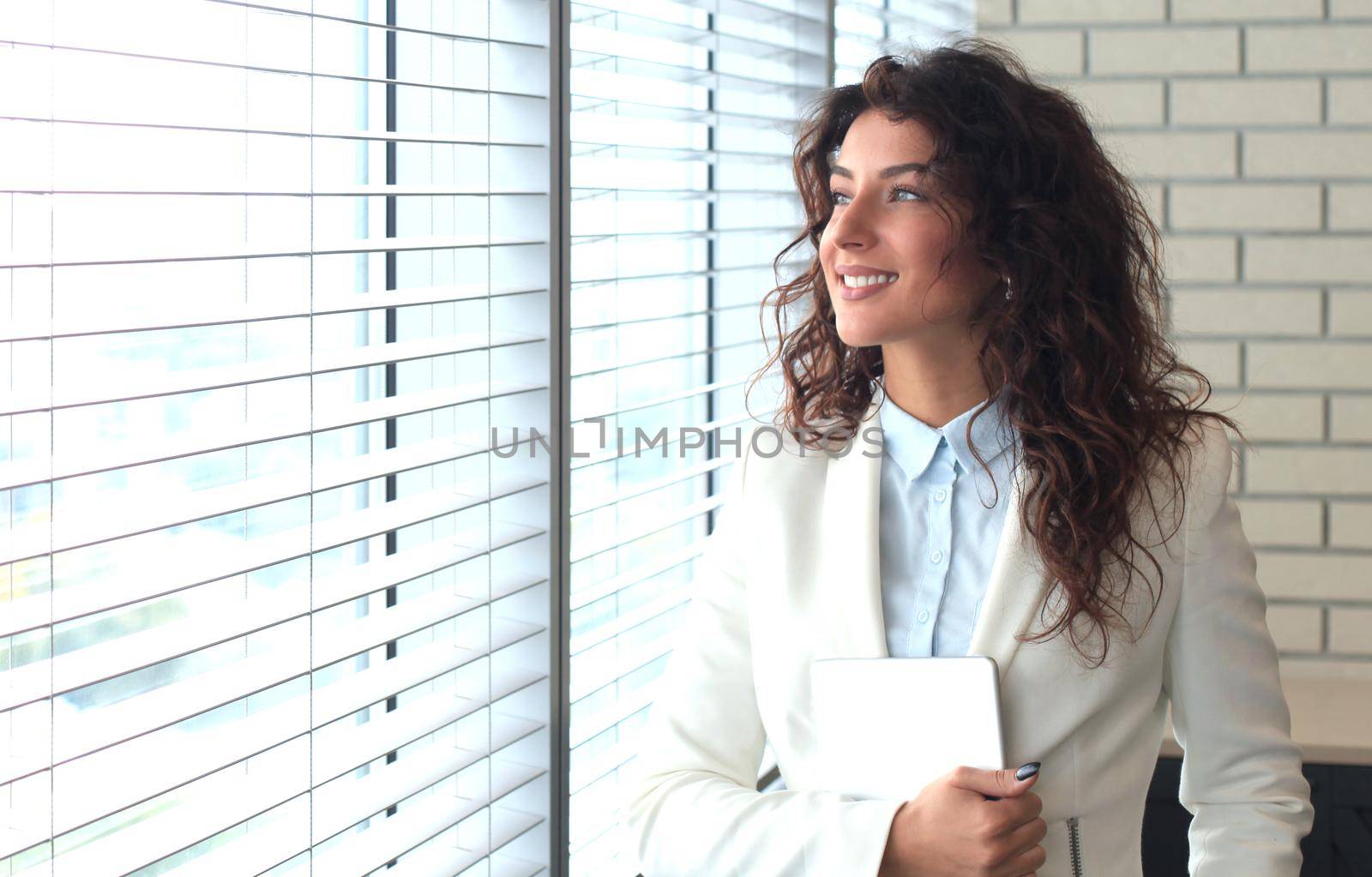 Modern business woman in the office with copy space