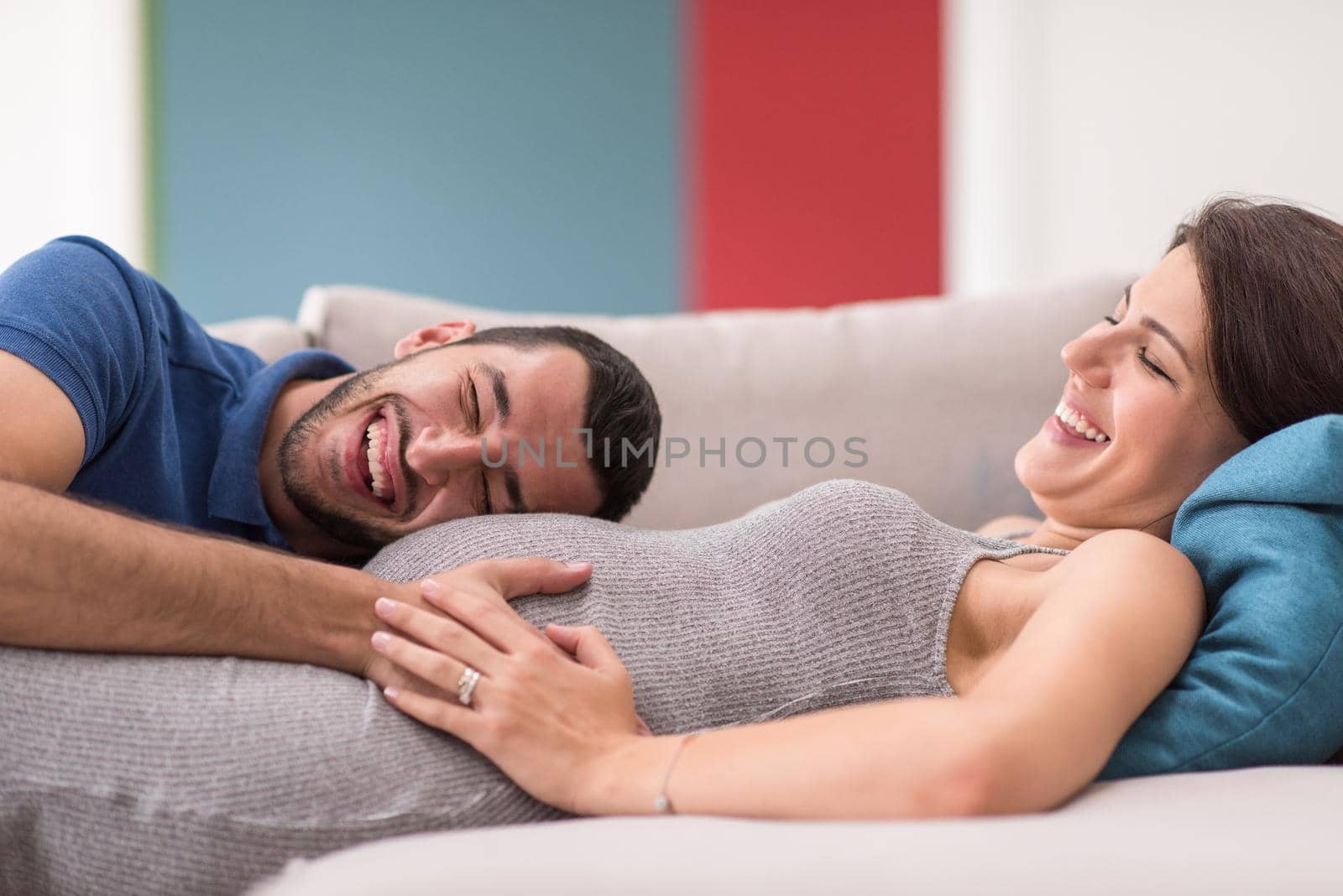 future dad listening the belly of his pregnant wife by dotshock