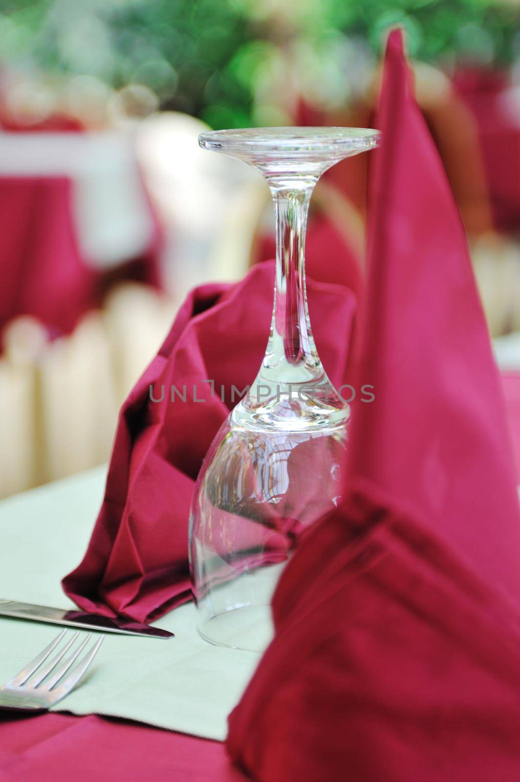 restaurant table with empty wine glass by dotshock