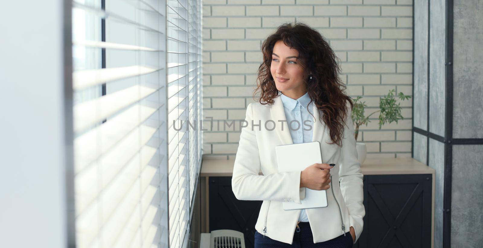 Modern business woman in the office with copy space