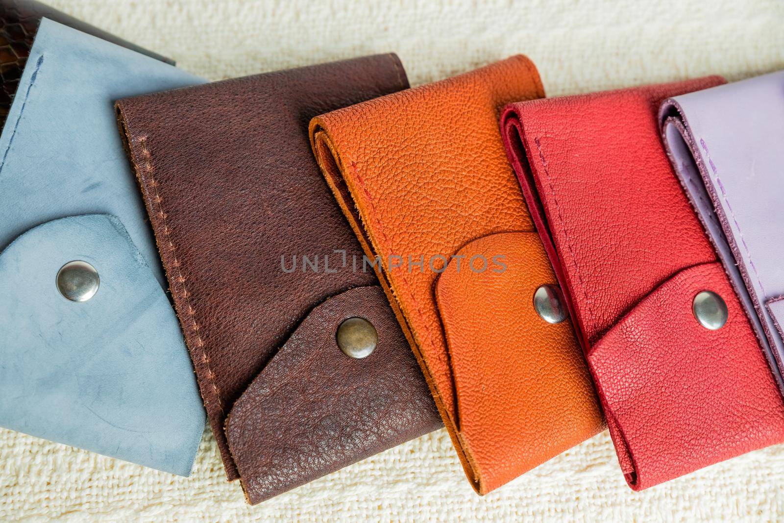 Colorful leather wallets.Leather handmade wallets of different forms