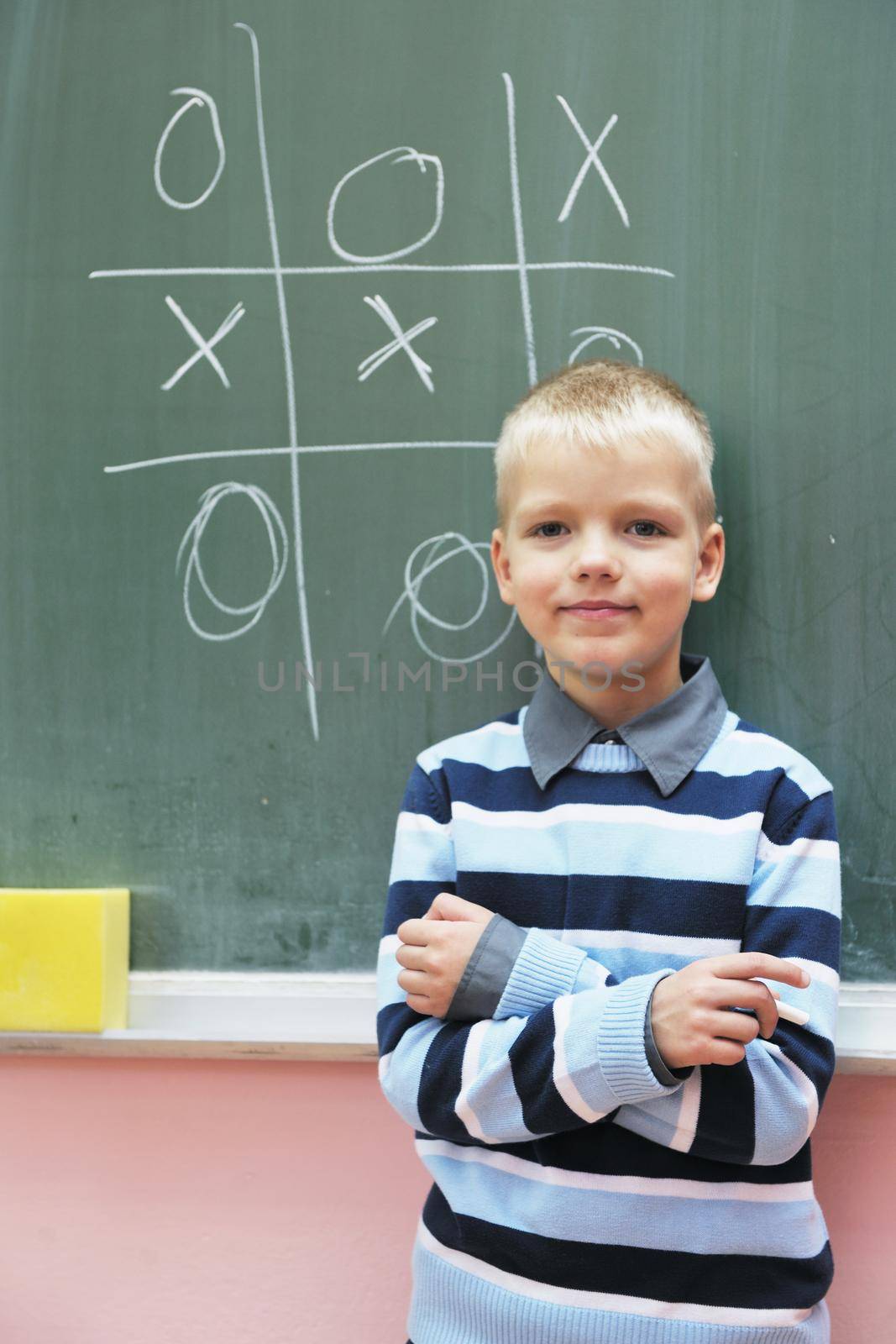 happy young boy at first grade math classes  by dotshock