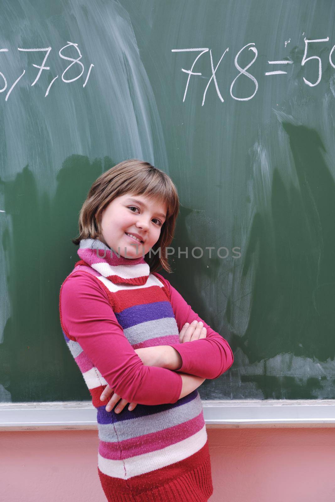 happy school girl on math classes finding solution and solving problems