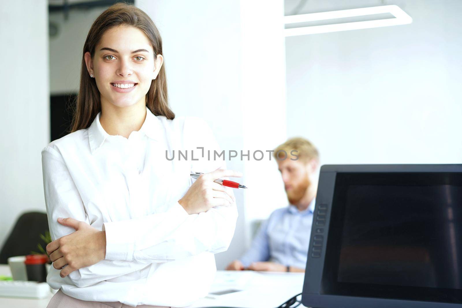 business woman with her staff, people group in background at modern bright office indoors.