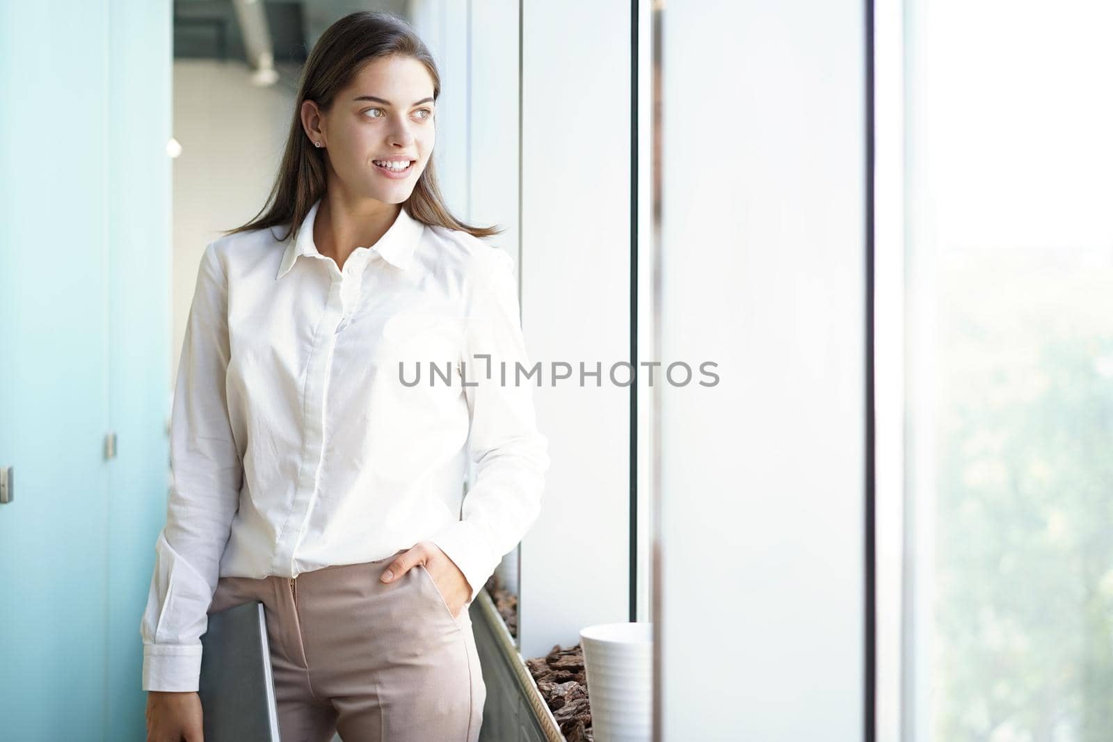 Modern business woman in the office with copy space. by tsyhun