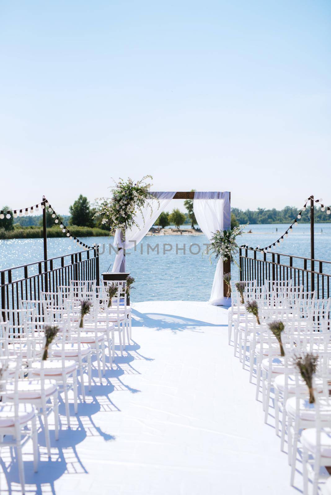 wedding ceremony area, arch chairs decor