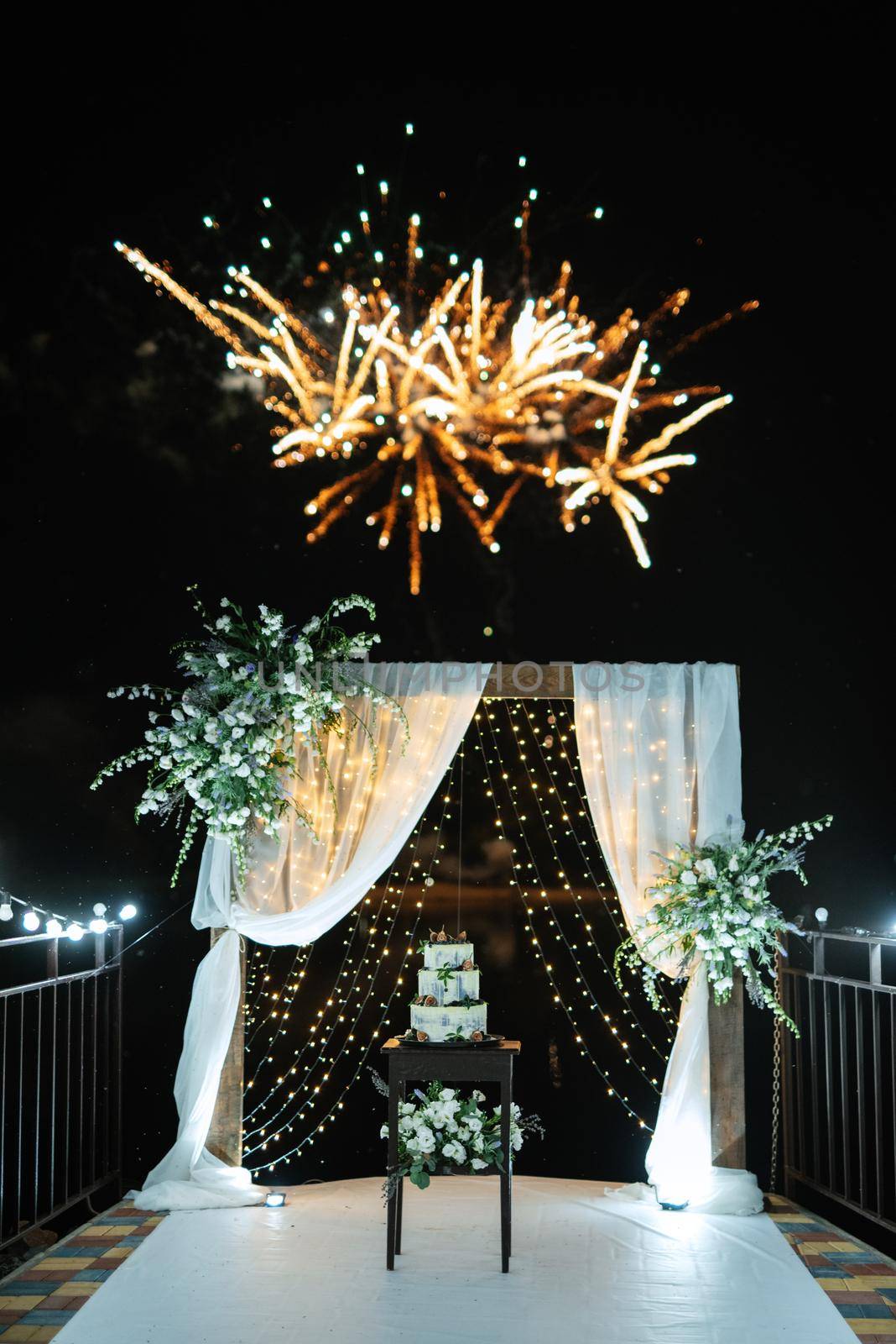 wedding cake at the wedding of the newlyweds with fire