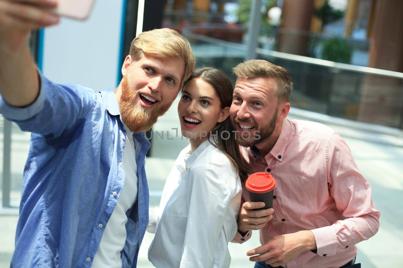 Group shot of colleagues having fun in their office