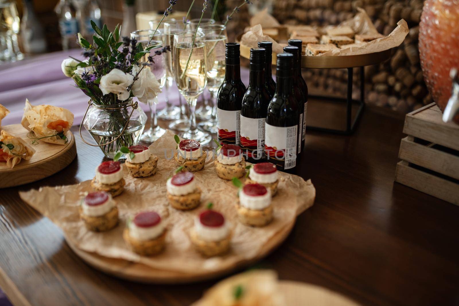 welcome buffet with alcohol and snacks, sandwiches, cupcakes