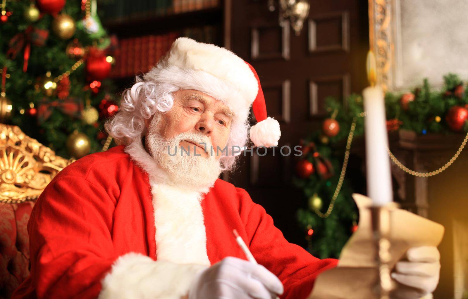 Portrait of Santa Claus answering Christmas letters.