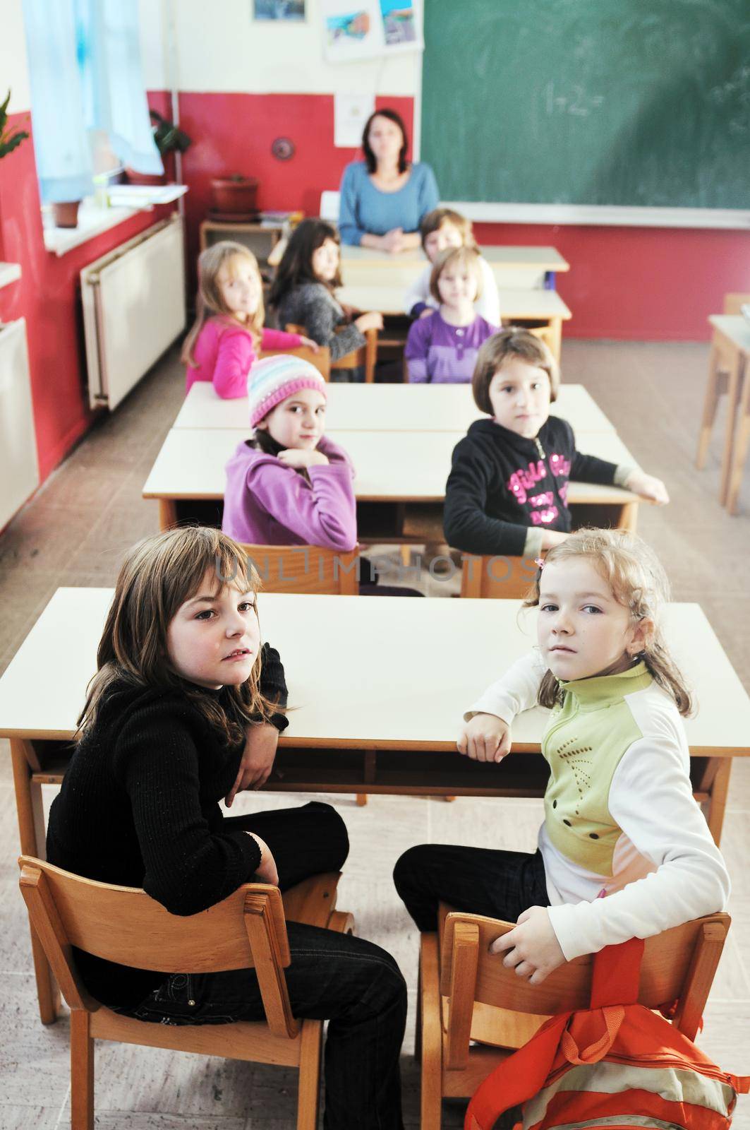 happy kids with  teacher in  school classroom by dotshock