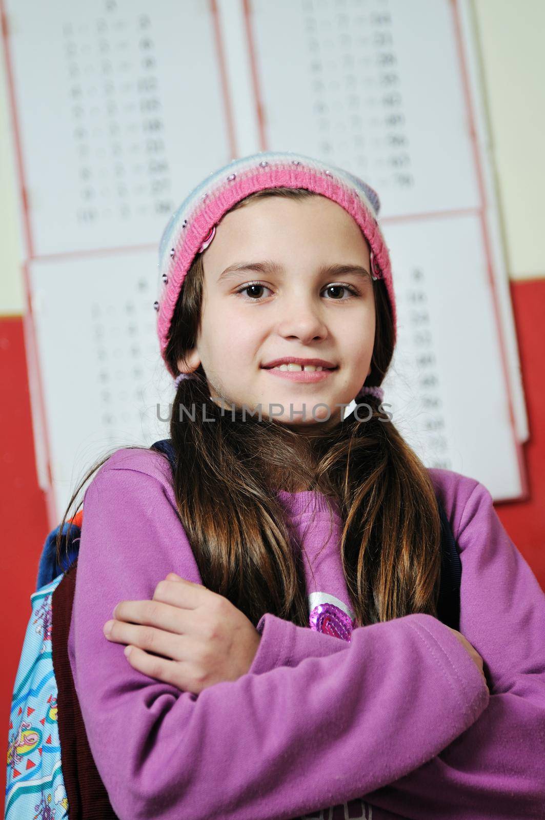 happy school girl on math classes finding solution and solving problemshappy young school girl portrait on math class