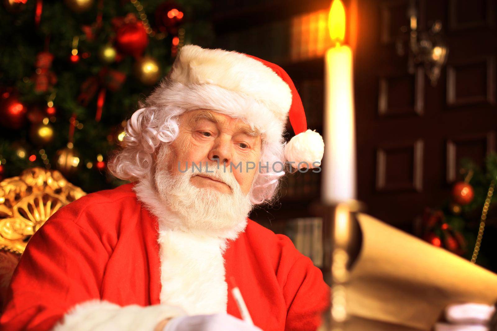 Portrait of Santa Claus answering Christmas letters.