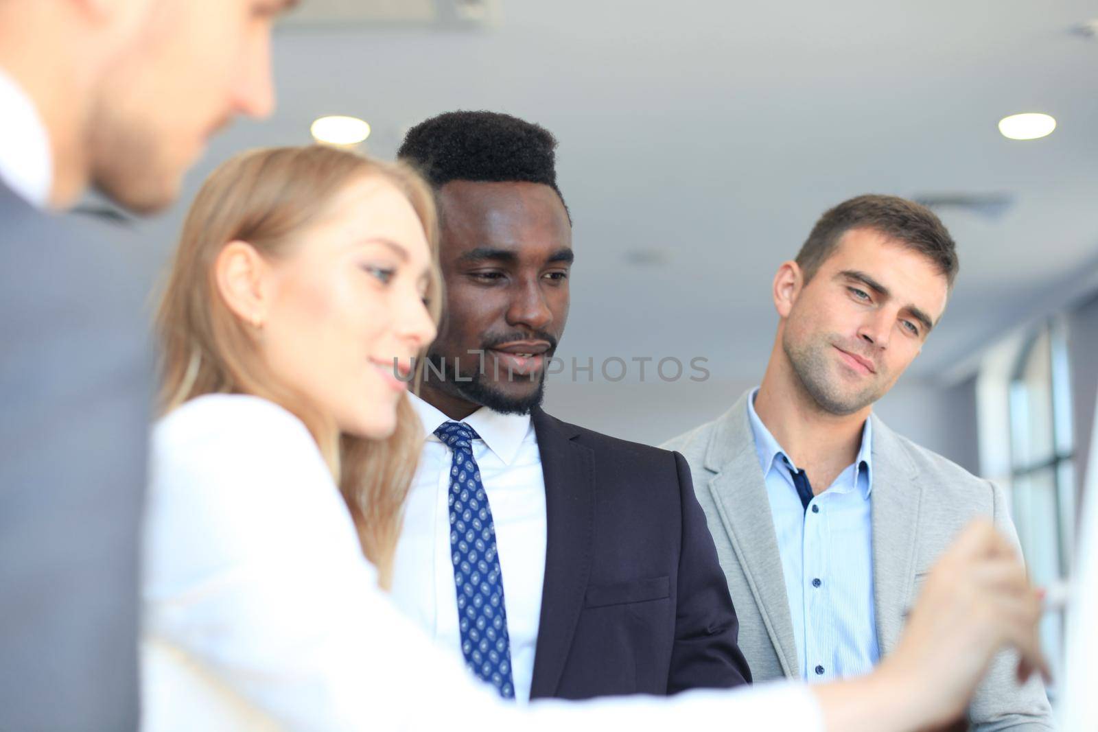Business people team at presentation working with charts and diargams at flipchart.