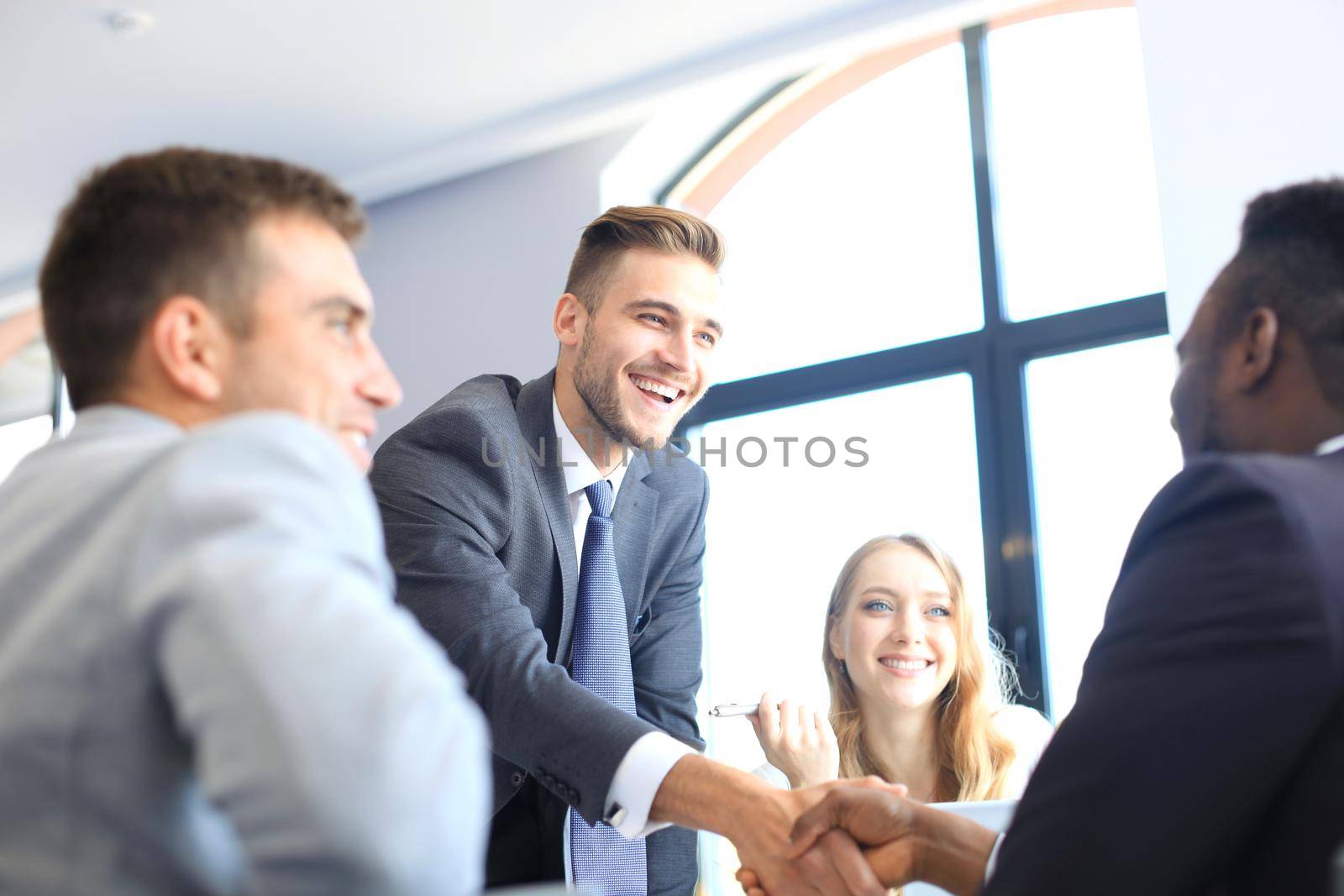 Business people shaking hands, finishing up a meeting