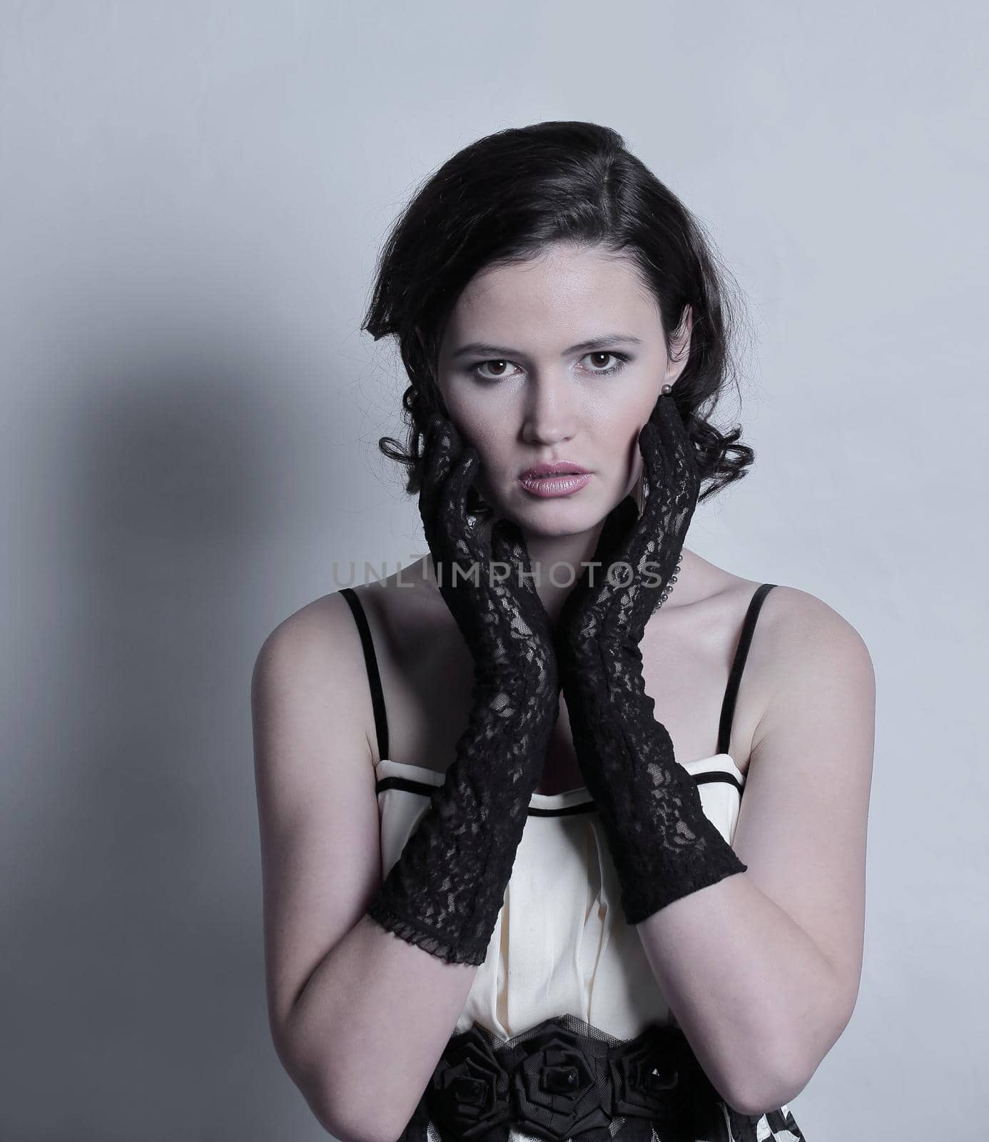 portrait of stylish young woman.isolated on gray background.photo with copy space