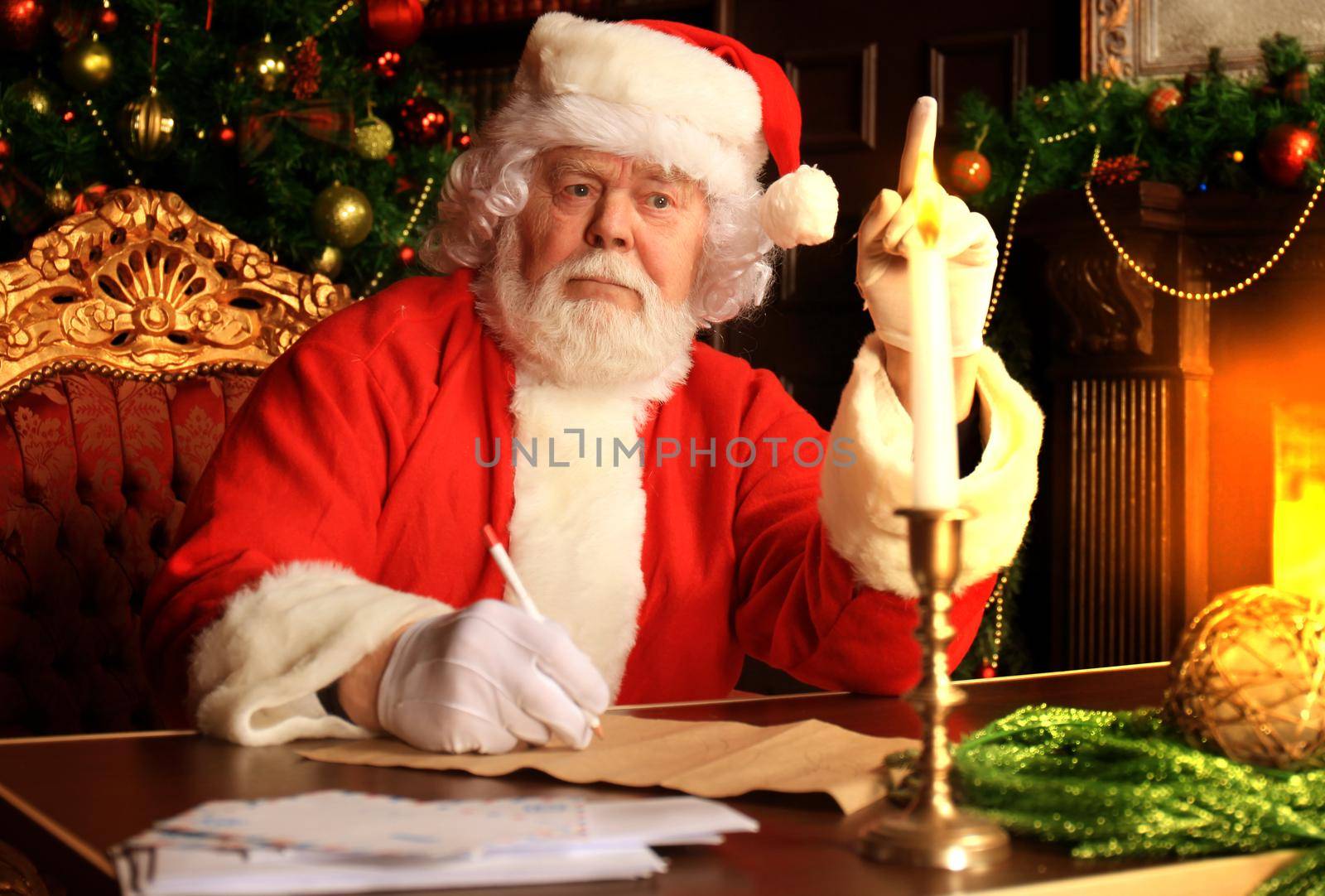 Portrait of Santa Claus answering Christmas letters.