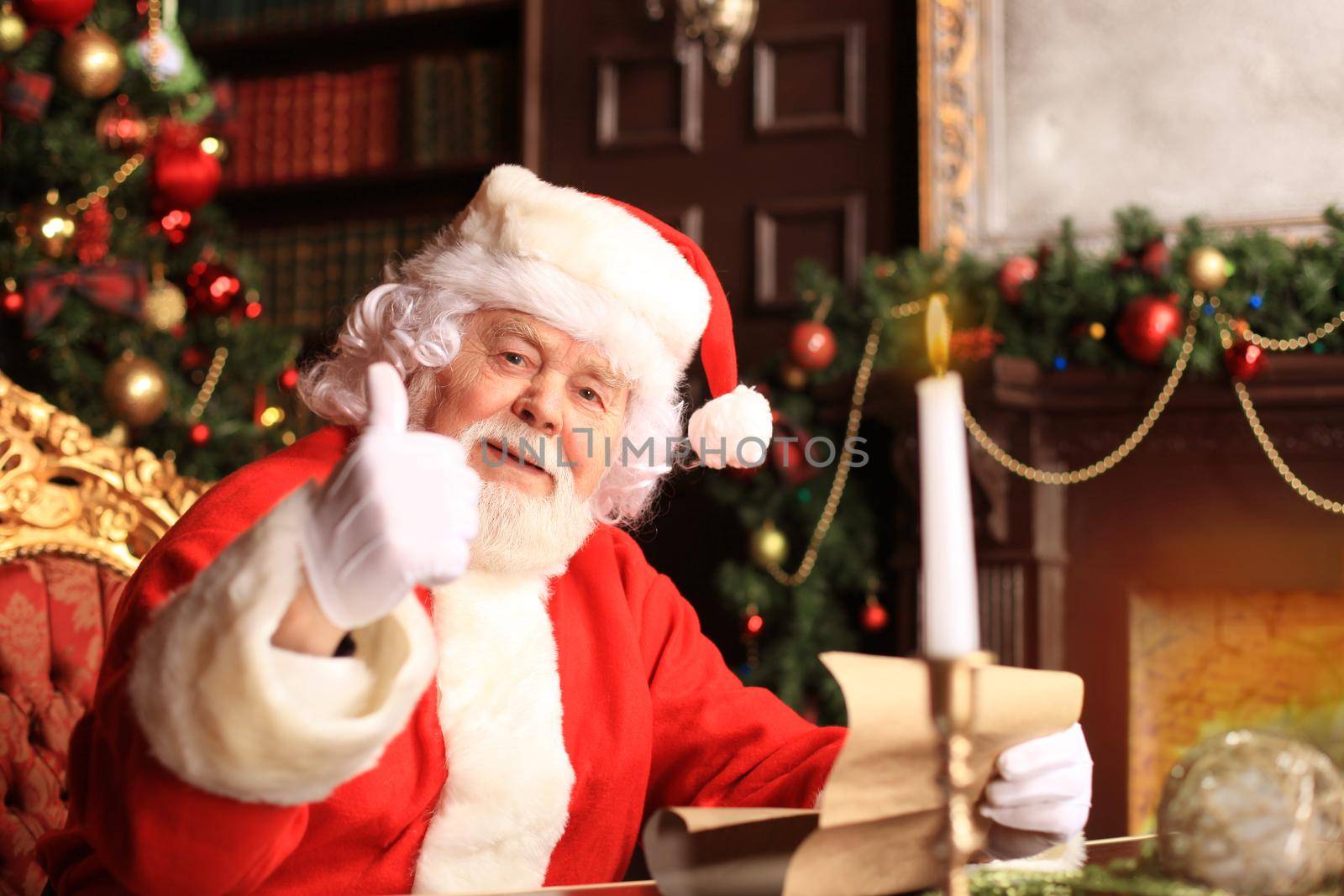 Santa Claus standing with thumbs up. Home decoration.