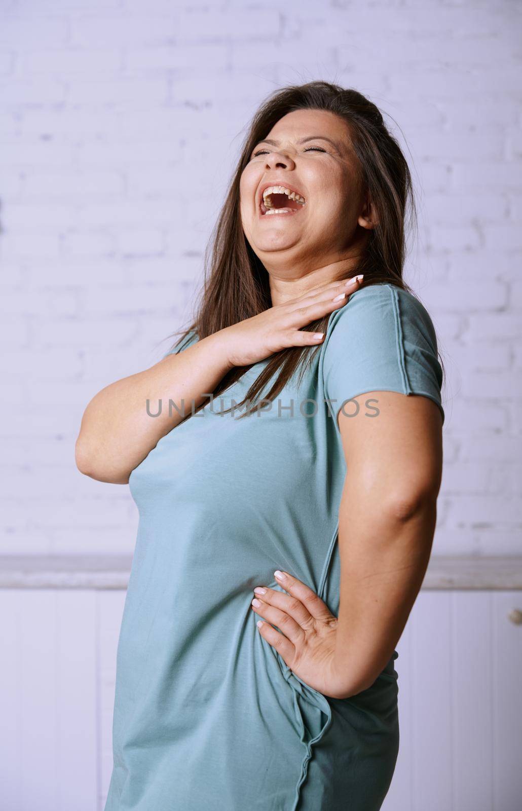 Portrait of the happy plus size model 