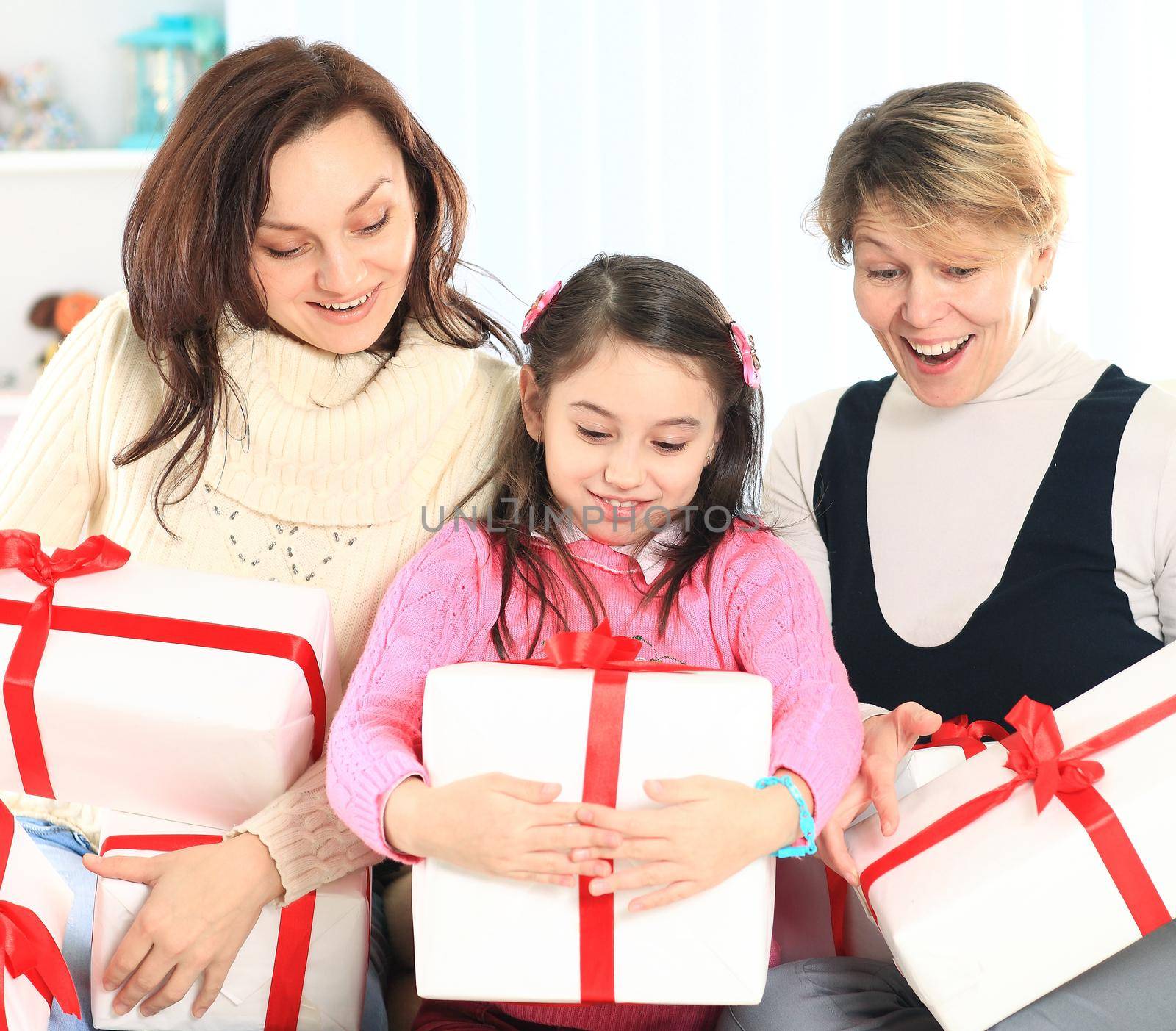 close up.happy family opening a box of gifts by SmartPhotoLab