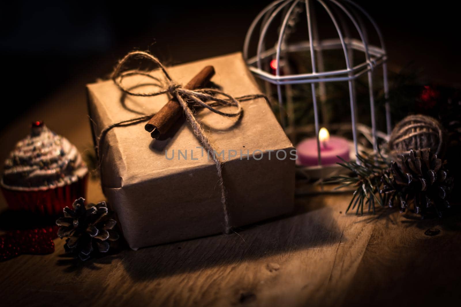 vintage gift box and candle on a Christmas background .photo with copy space