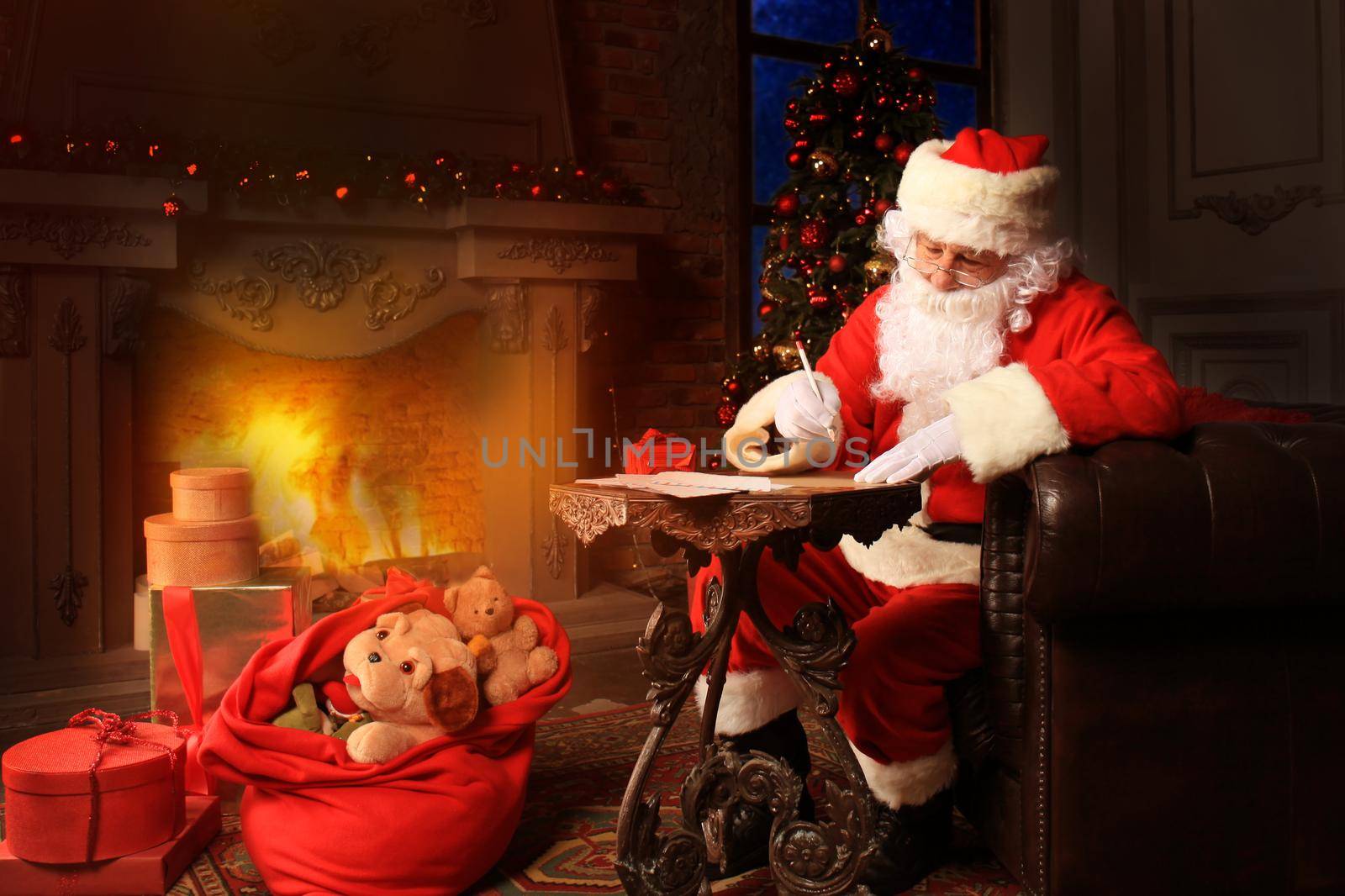 Portrait of Santa Claus answering Christmas letters. by tsyhun