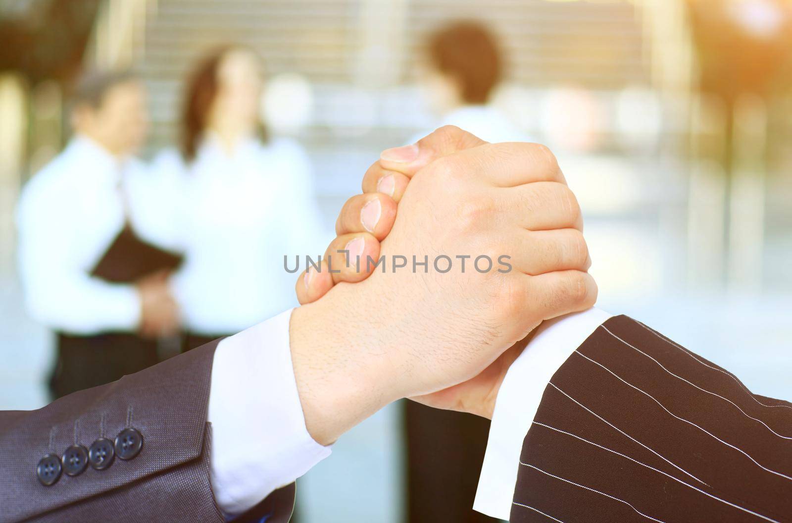 close-up . confident business handshake on blurred office background
