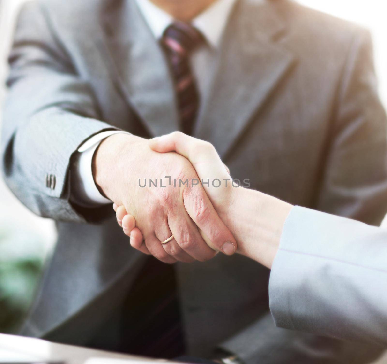 Business people shaking hands, finishing up a meeting.concept of partnership