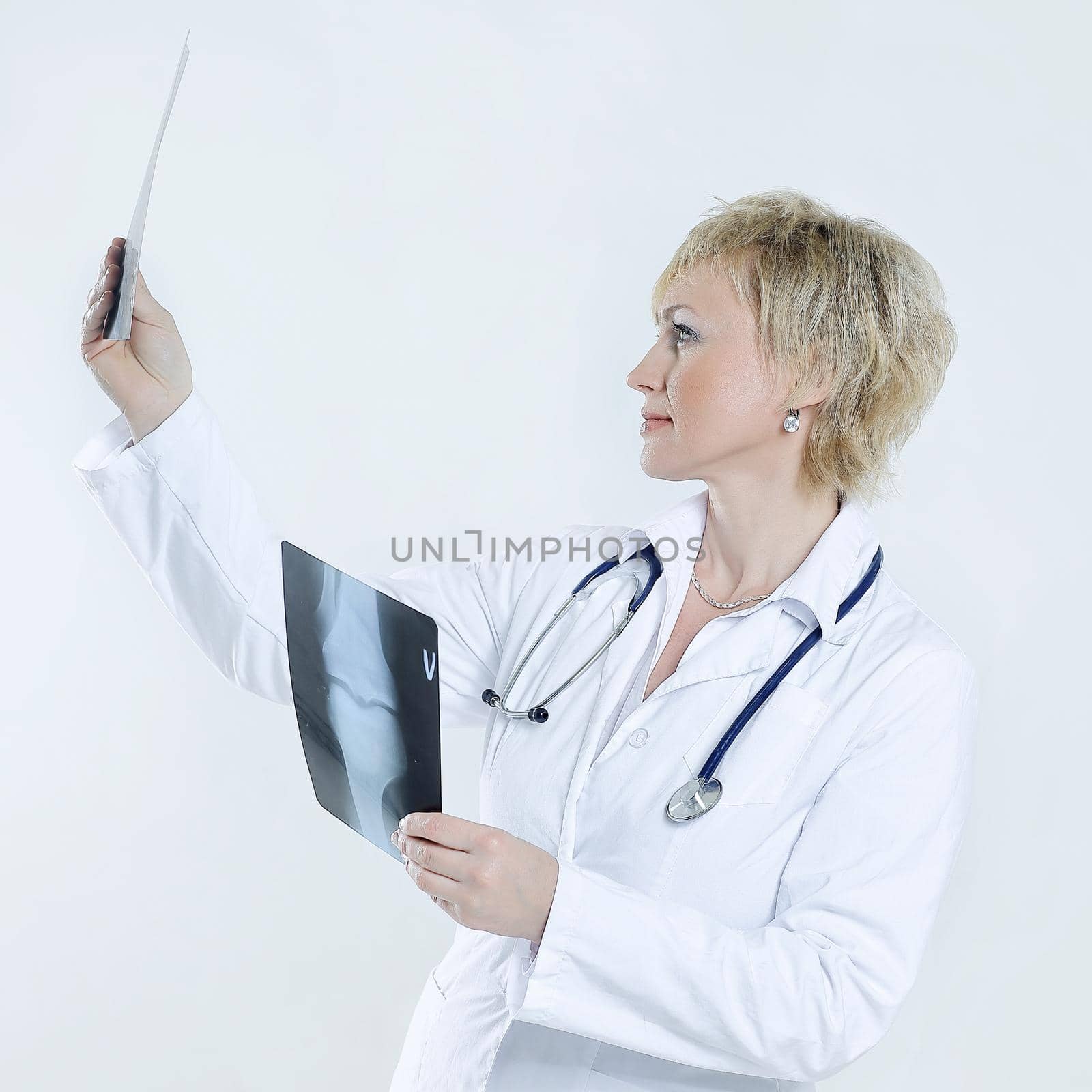 female doctor checking x-ray of the patient .isolated on white