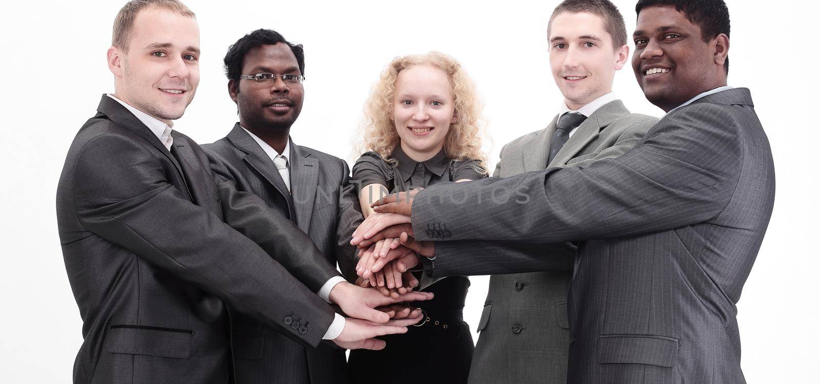Business team showing union with their hands together forming a pile.photo with copy space
