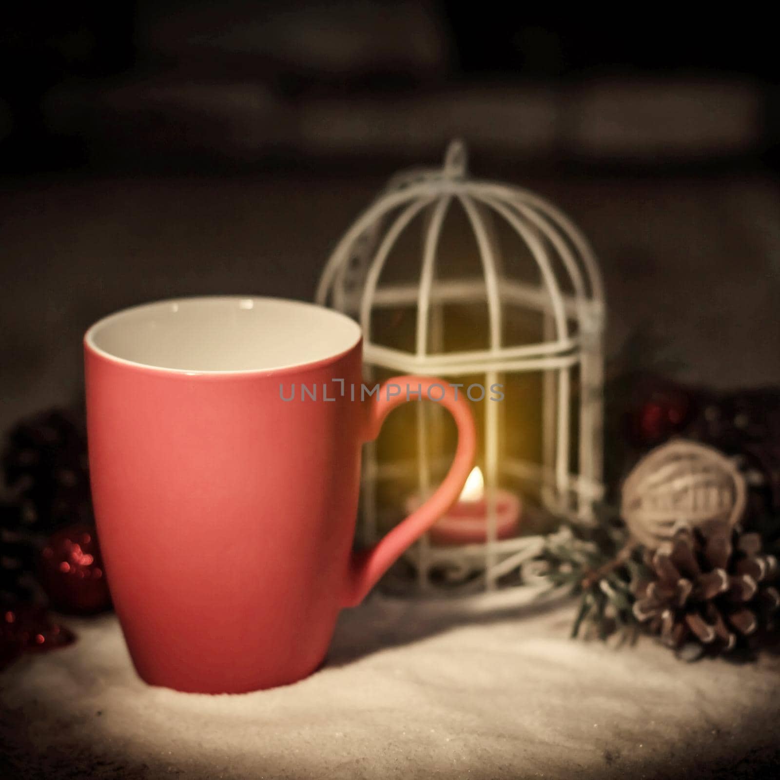 closeup.red Christmas Cup and the candle on the holiday table by SmartPhotoLab