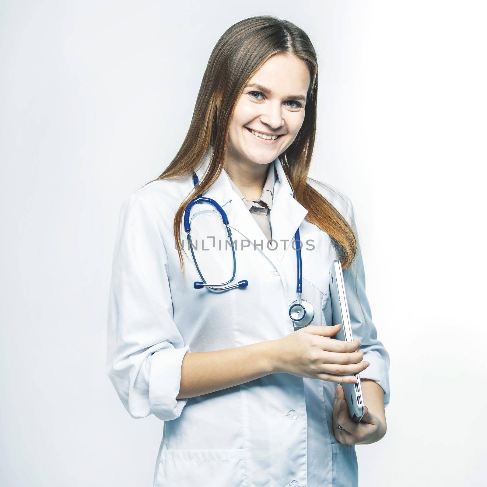 portrait - a family doctor with stethoscope on white background by SmartPhotoLab
