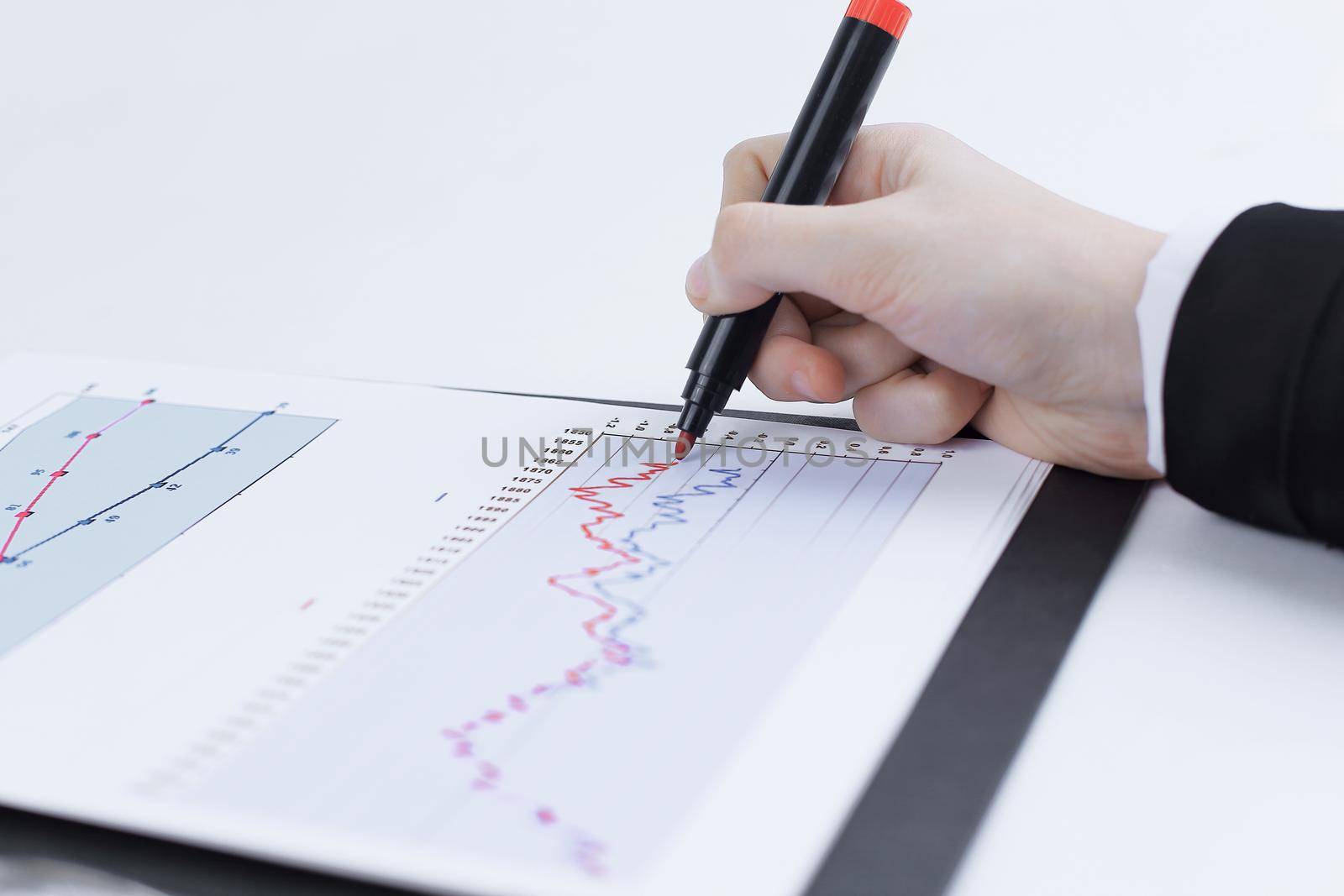 close-up. business woman working with a marketing schedule.isolated on white background