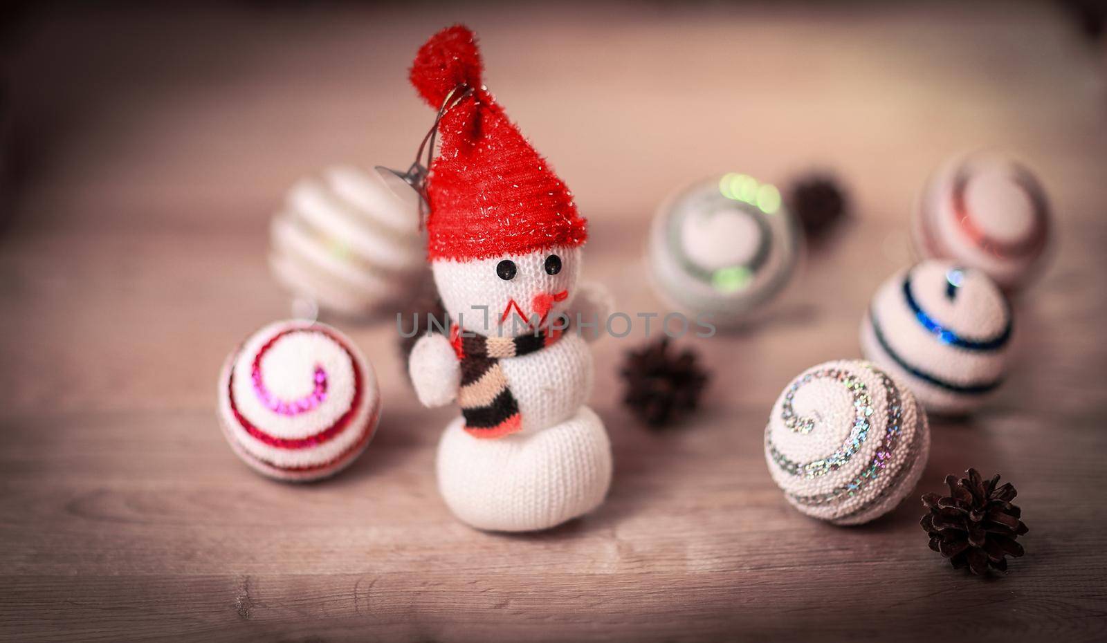 toy snowman and gingerbread house at the Christmas table .photo with copy space.