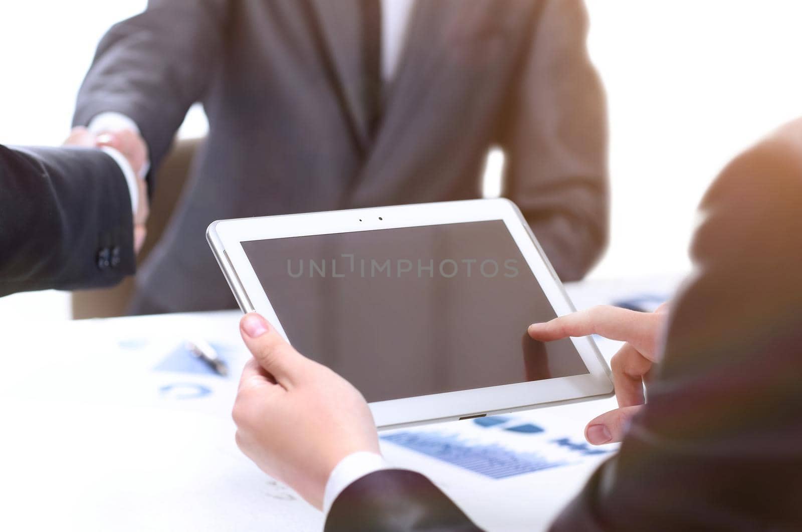 close up. businessman using digital tablet in office.people and technology