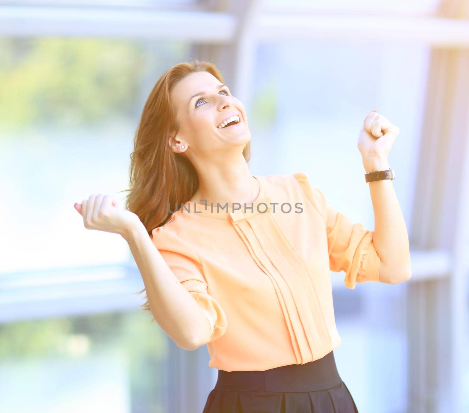 happy business woman on blurred background by SmartPhotoLab