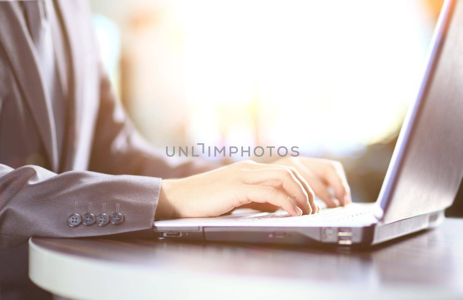 close up. businessman typing on laptop keyboard by SmartPhotoLab