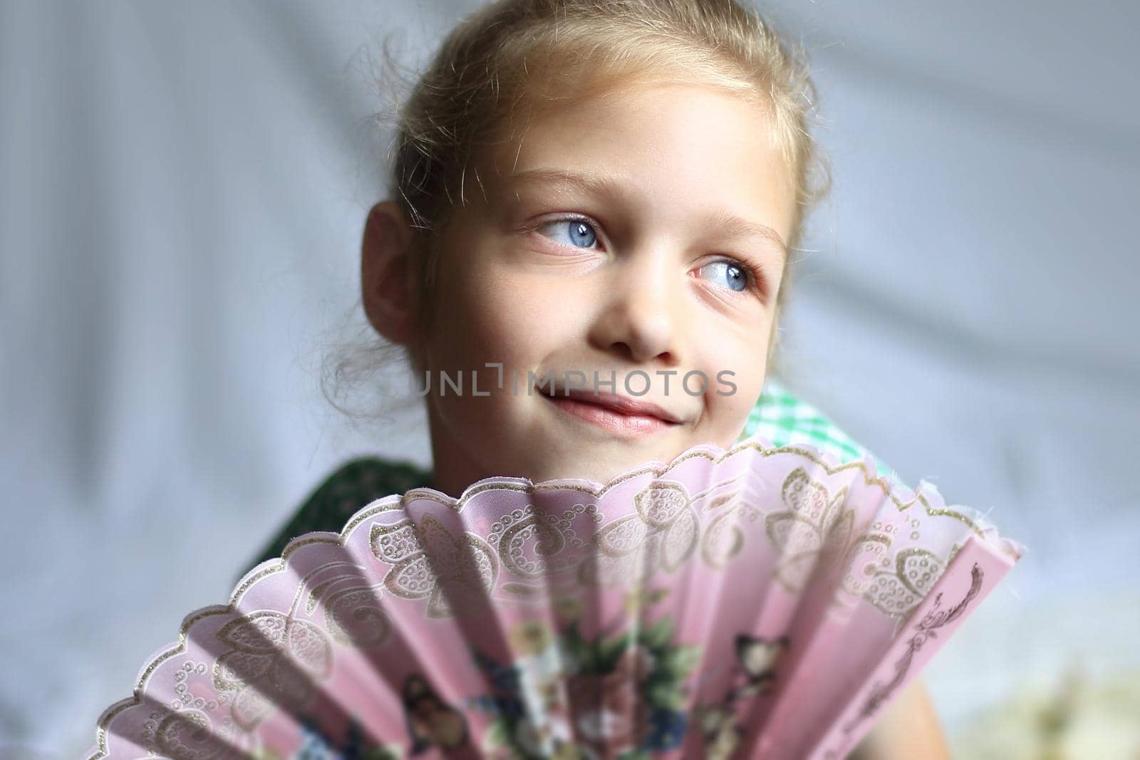 portrait - cute on bright background little girl with a fan by SmartPhotoLab