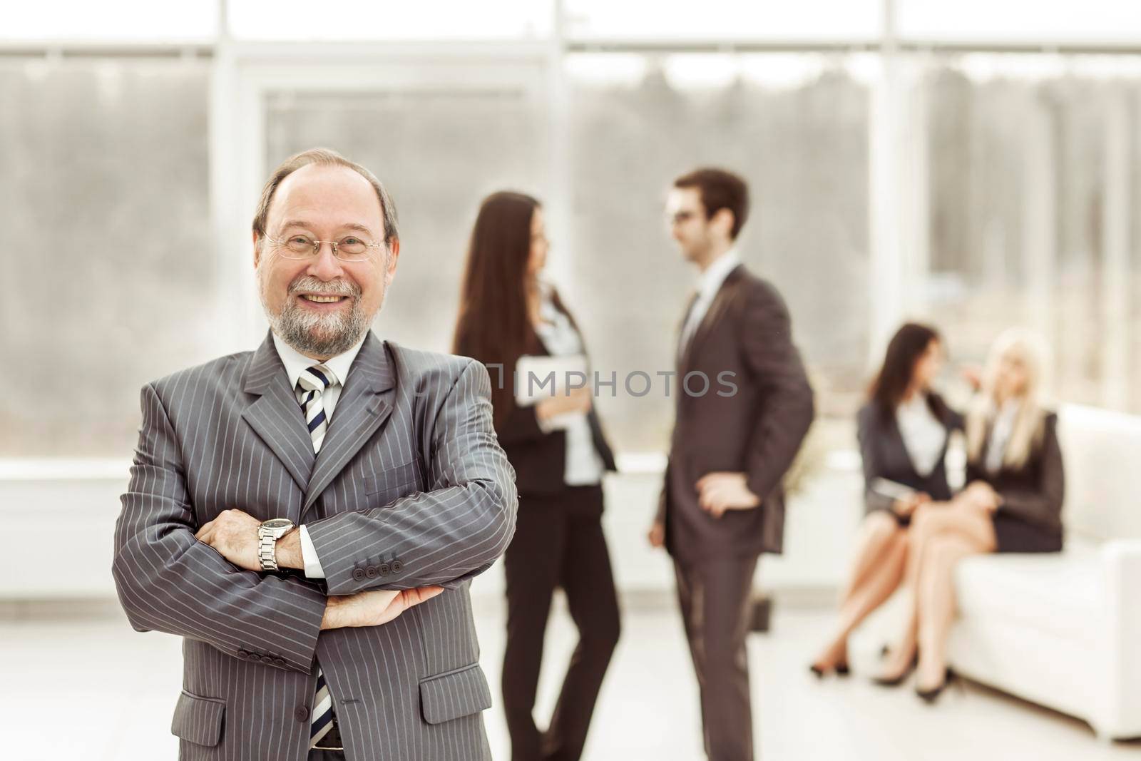 portrait of the General counsel of the company on the background of business team in office by SmartPhotoLab