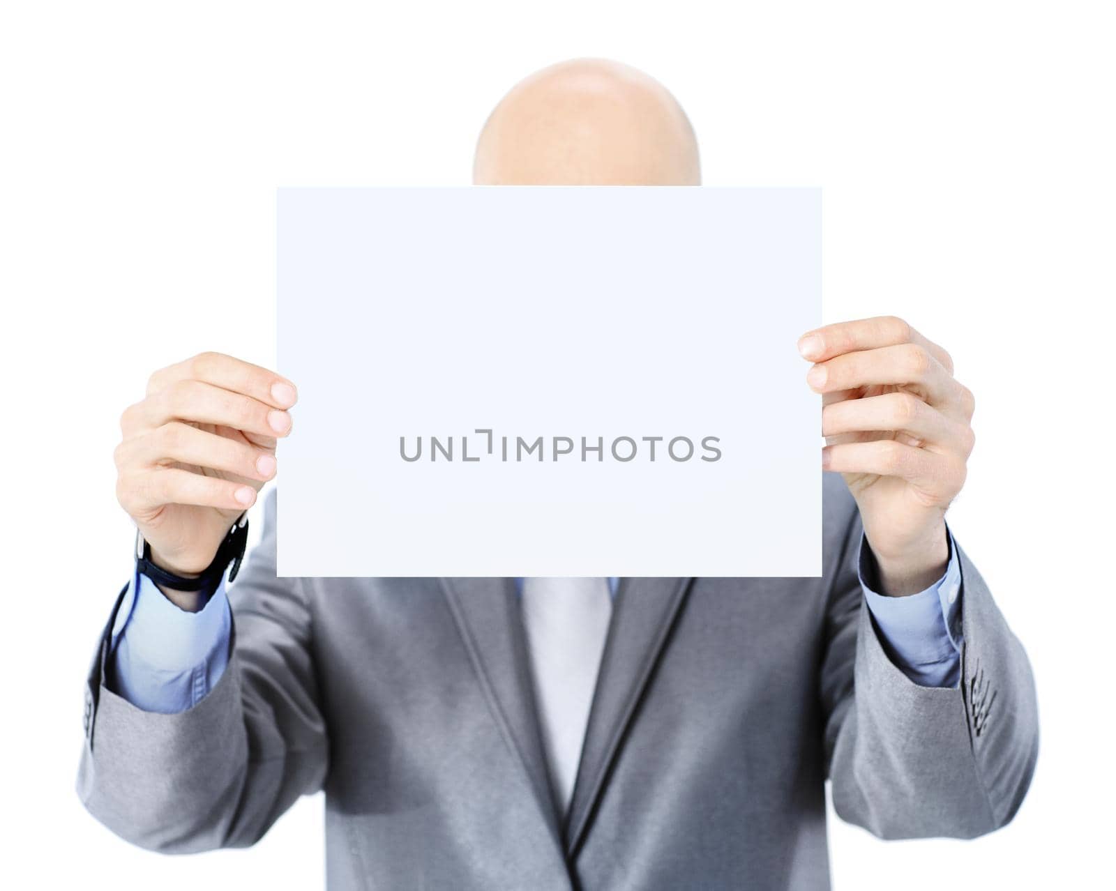 Nice businessman holds white poster. Isolated on a white by SmartPhotoLab