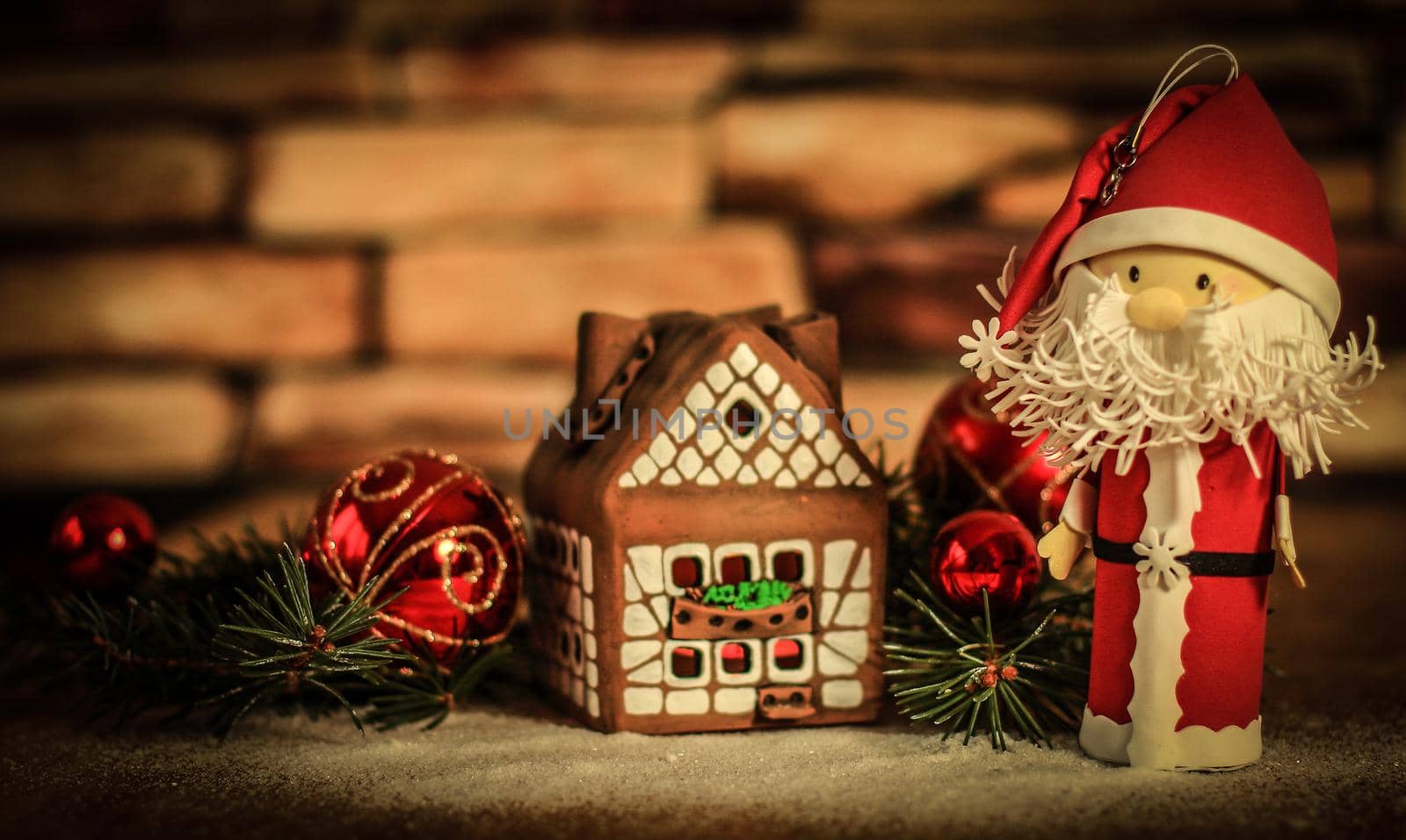 gingerbread house,Christmas balls and Santa Claus. the concept of the celebration.photo with copy space