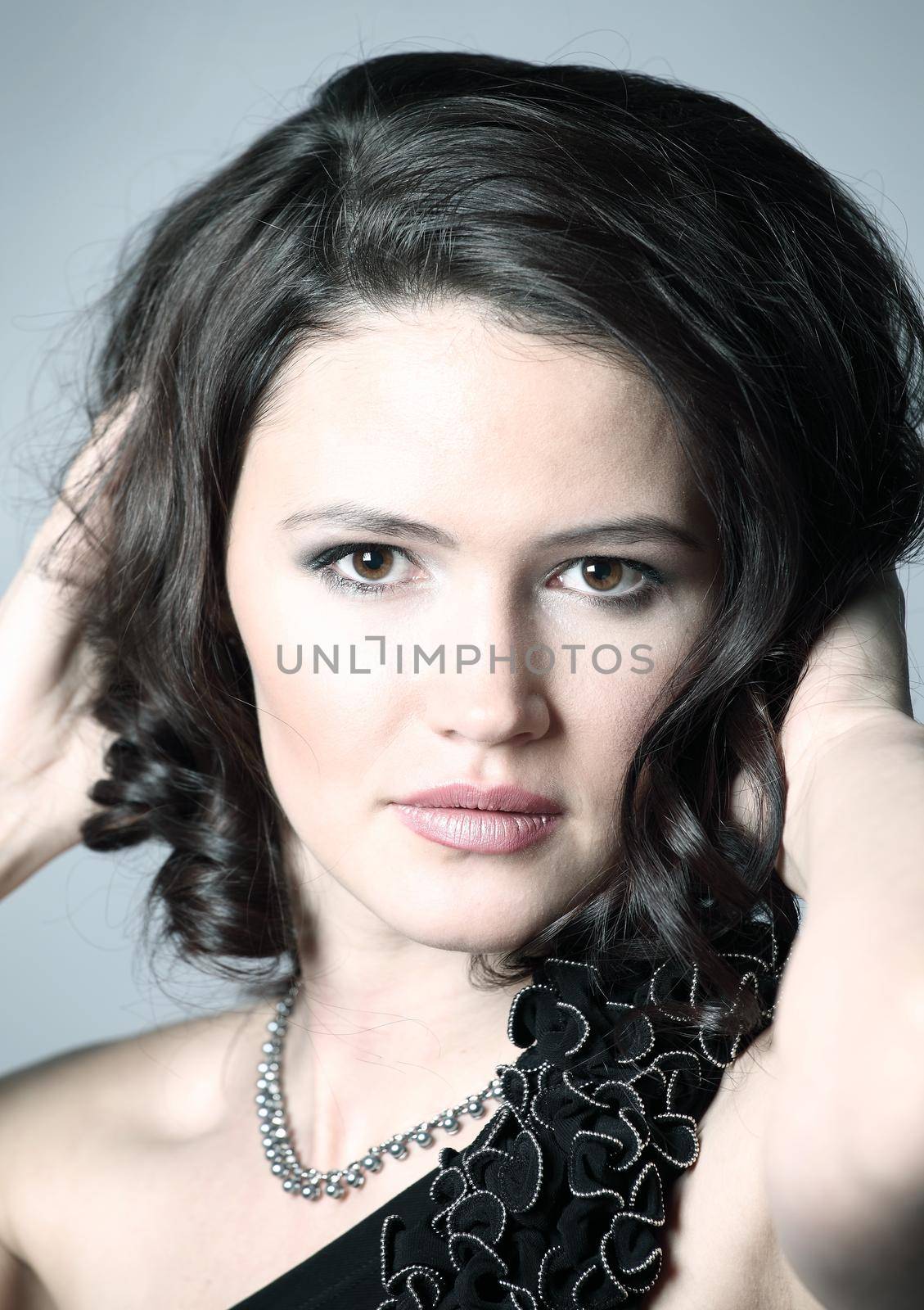 Fashion. portrait of a young beautiful dark-haired woman