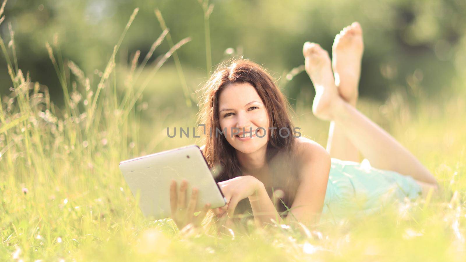 beautiful young woman on field in summer