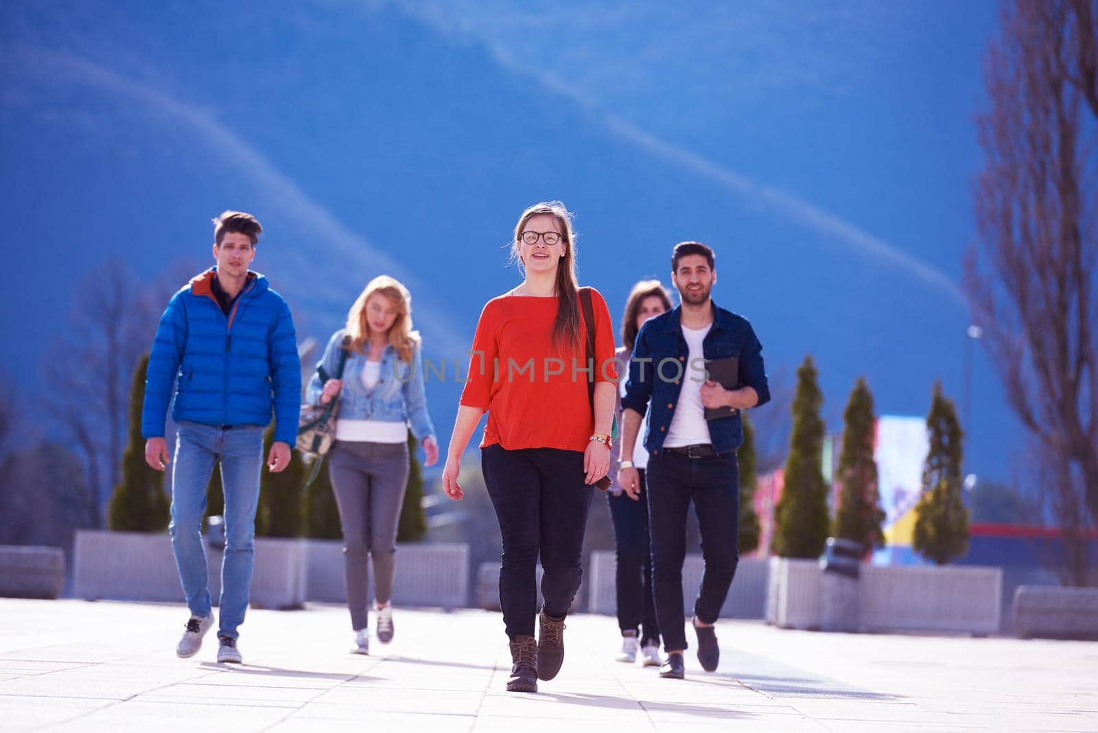 happy students group have fun outdoor in university campus park