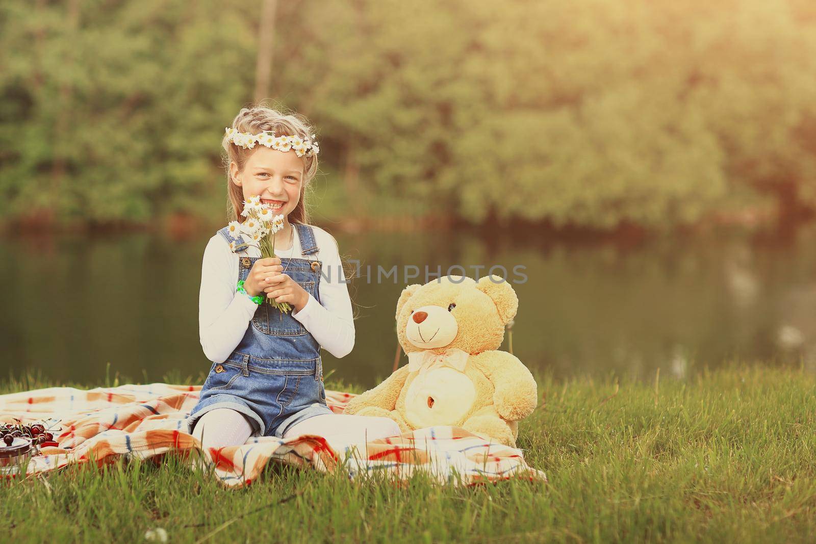 portrait of a little girl in a wreath with a soft toy near the r by SmartPhotoLab