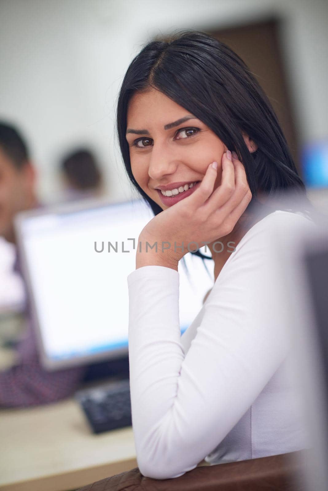 portrait of young female student at school classroom