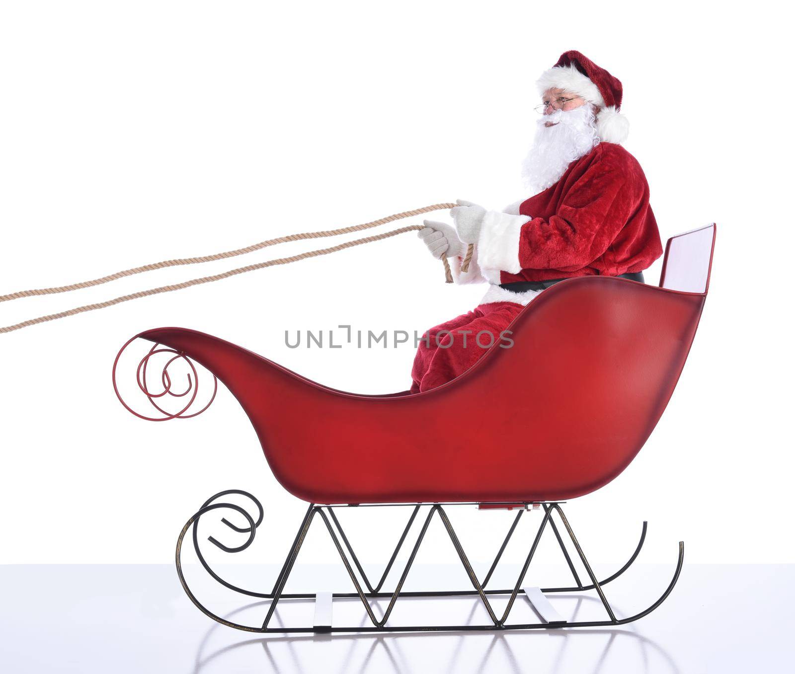 Santa Claus in his Sleigh, isolated on white. by sCukrov