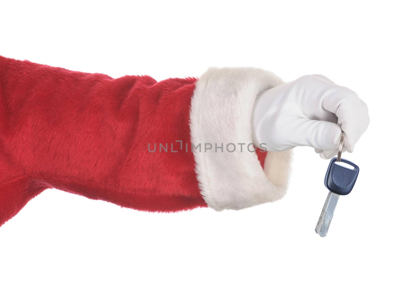 Santa Claus holding a set of car keys isolated over white. Hand and arm only in horizontal format.