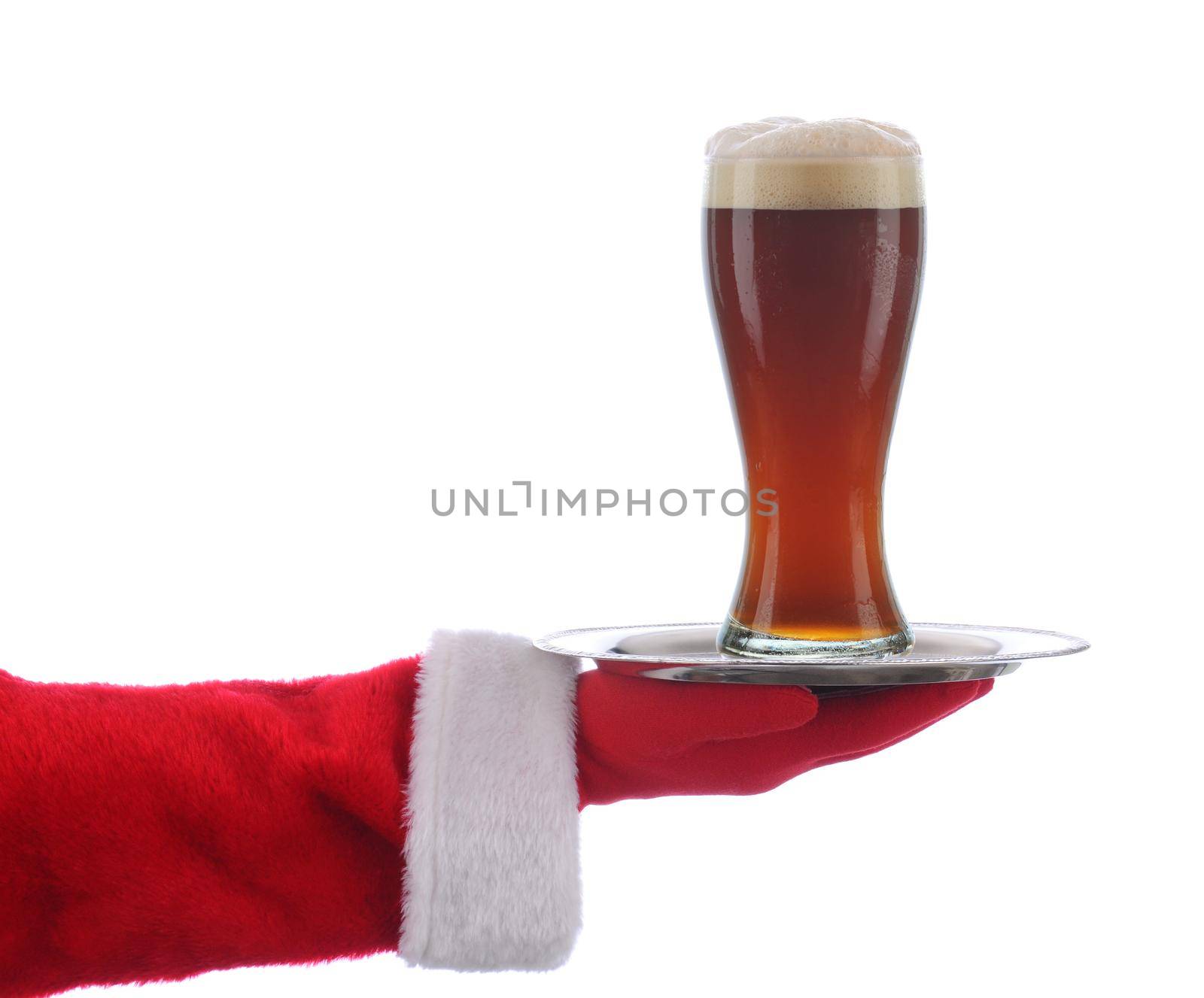 Santa Claus holding a serving tray with a glass of beer over a white background.